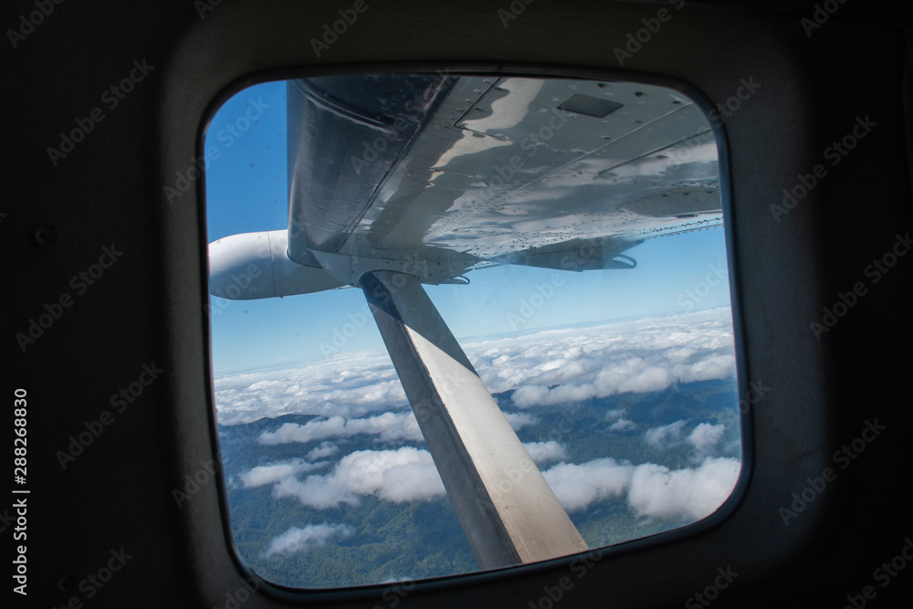 view from an aeroplane above the clouds view from an aeroplane above the clouds
