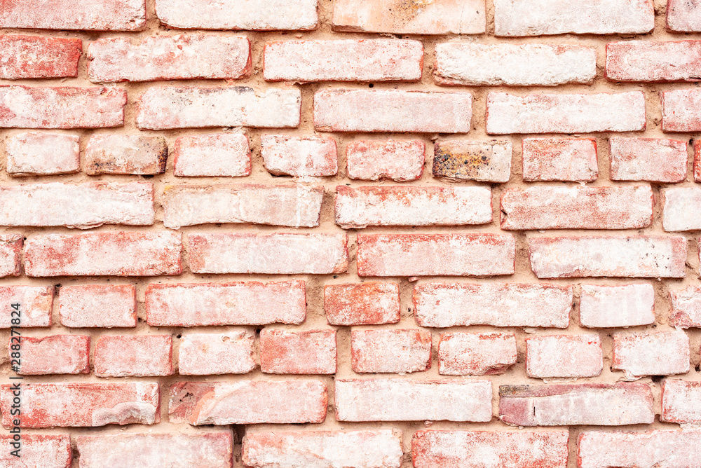 Texture of a brick wall with cracks and scratches which can be used as a background Texture of a brick wall with cracks and scratches which can be used as a background