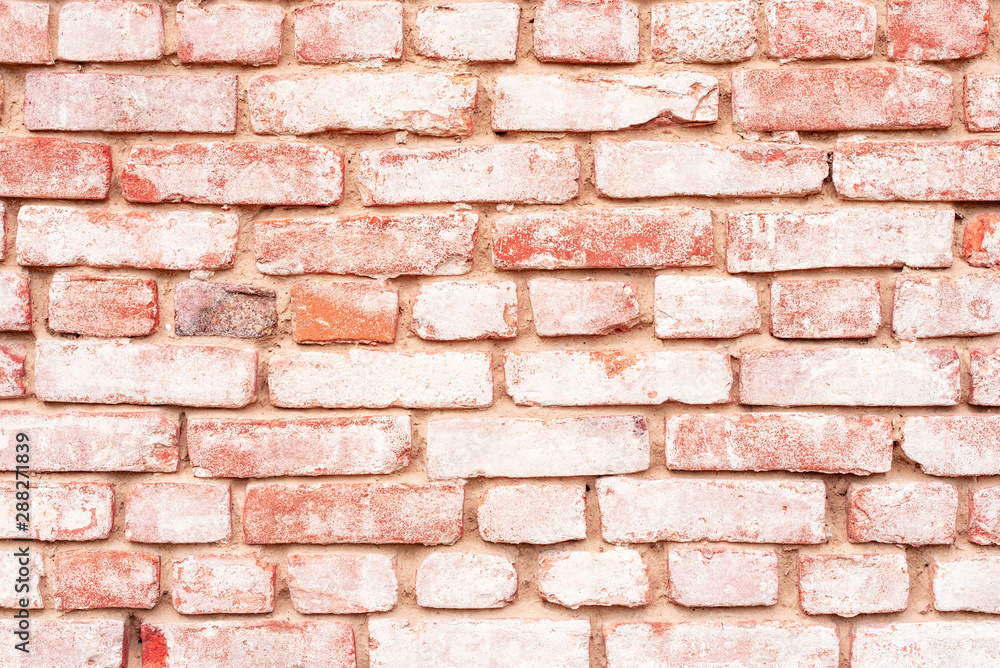 Obraz premium Texture of a brick wall with cracks and scratches which can be used as a background