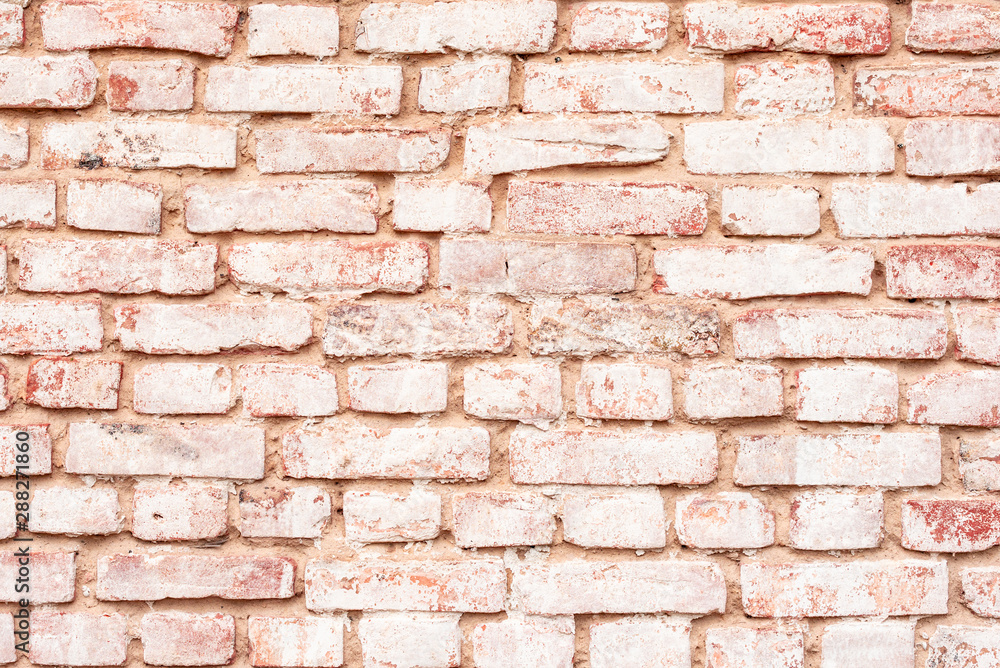 Obraz premium Texture of a brick wall with cracks and scratches which can be used as a background