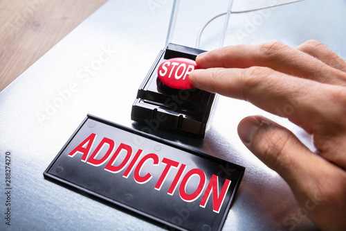 Obraz na plátně Man Pressing Stop Addiction Button