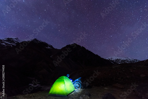 Tent under starry night in himalayas - India