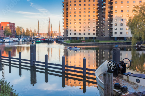 Sunset at the Oosterhaven harbor in historic city Groningen, Netherlands photo