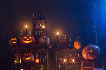 Halloween decoration with pumpkins and magic potions indoor