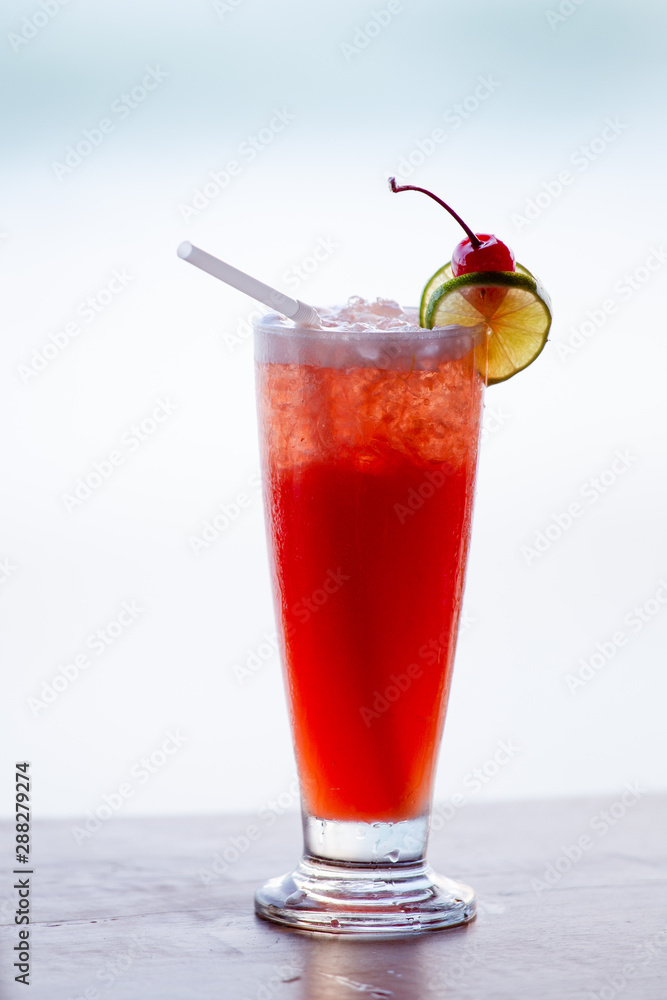Ice tea with lemon slices on table beach background. Ice tea with lemon slices on table beach background.