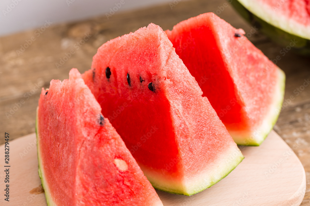 Slices of watermelon on wooden table, Closeup Slices of watermelon on wooden table, Closeup