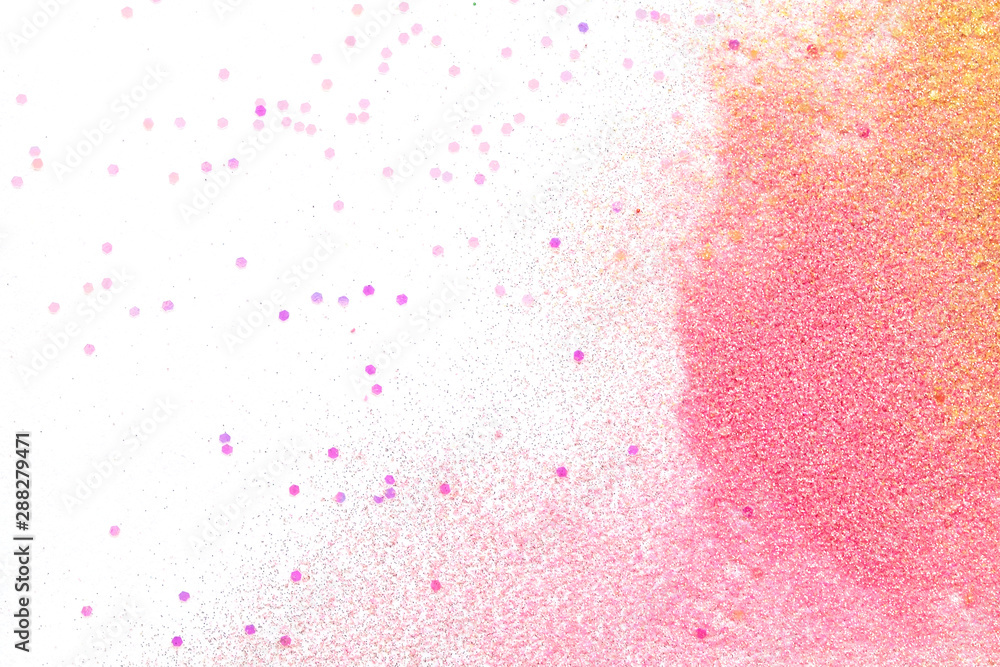 Many multi-colored spangles are scattered on a white background. Many multi-colored spangles are scattered on a white background.