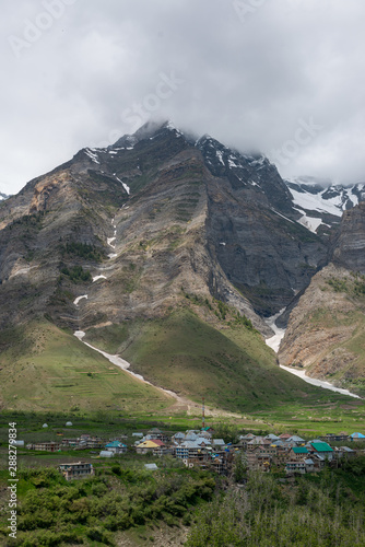 Panoramic view of the village beside river photo