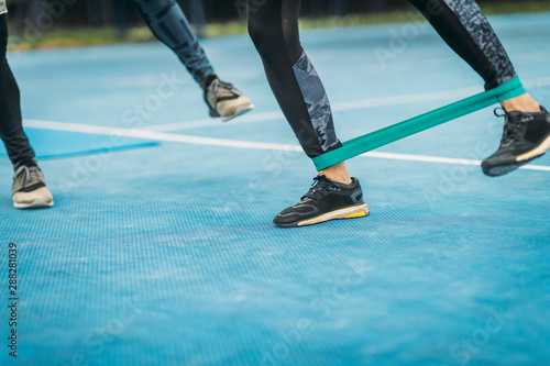 Woman Exercising with Resistance Band