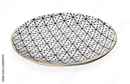 Ceramics decorative plates, Plate with geometric pattern and gold rim, isolated on white background with clipping path, Side view  © Dewins