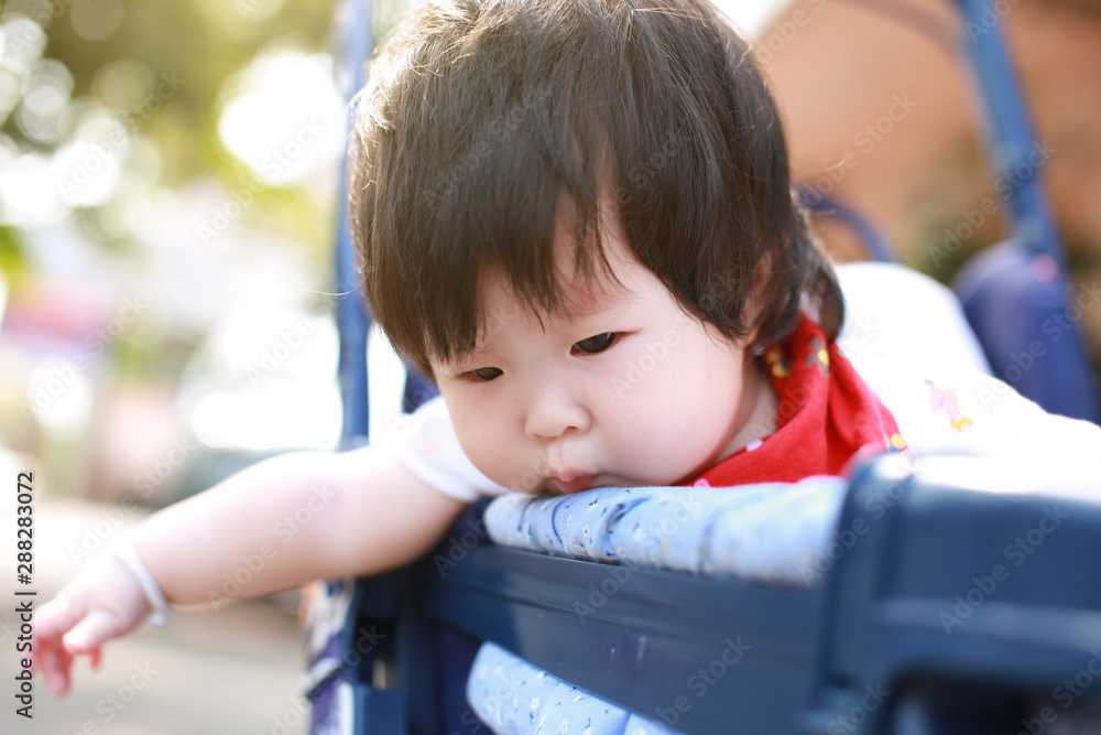 Cute asian Baby in a stroller Cute asian Baby in a stroller