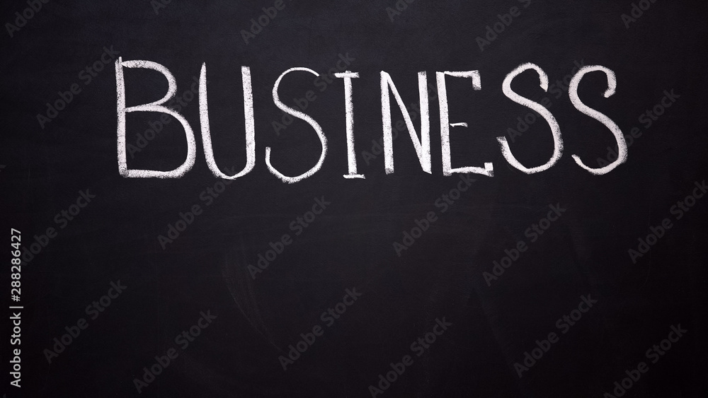Business written on blackboard, startup development, motivation and inspiration Business written on blackboard, startup development, motivation and inspiration