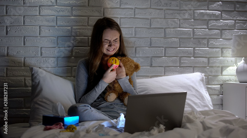 Φωτογραφία Depressed woman crying hugging toys, missing lost baby, infertility concept