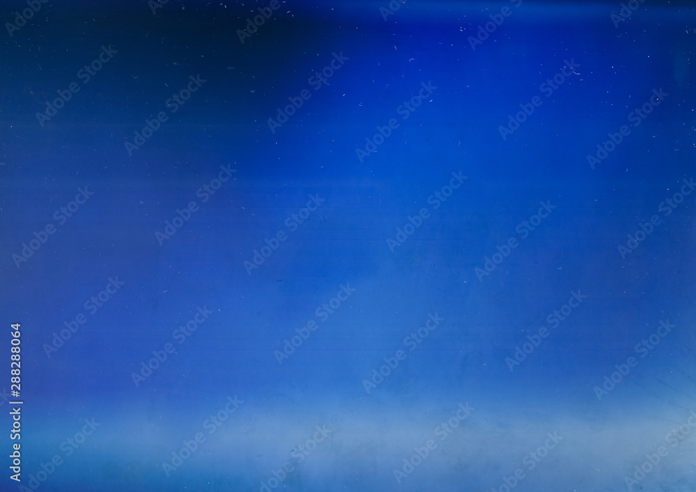 Fototapeta premium Blue light flare overlay. Aged filmstrip texture. Defocused glow.