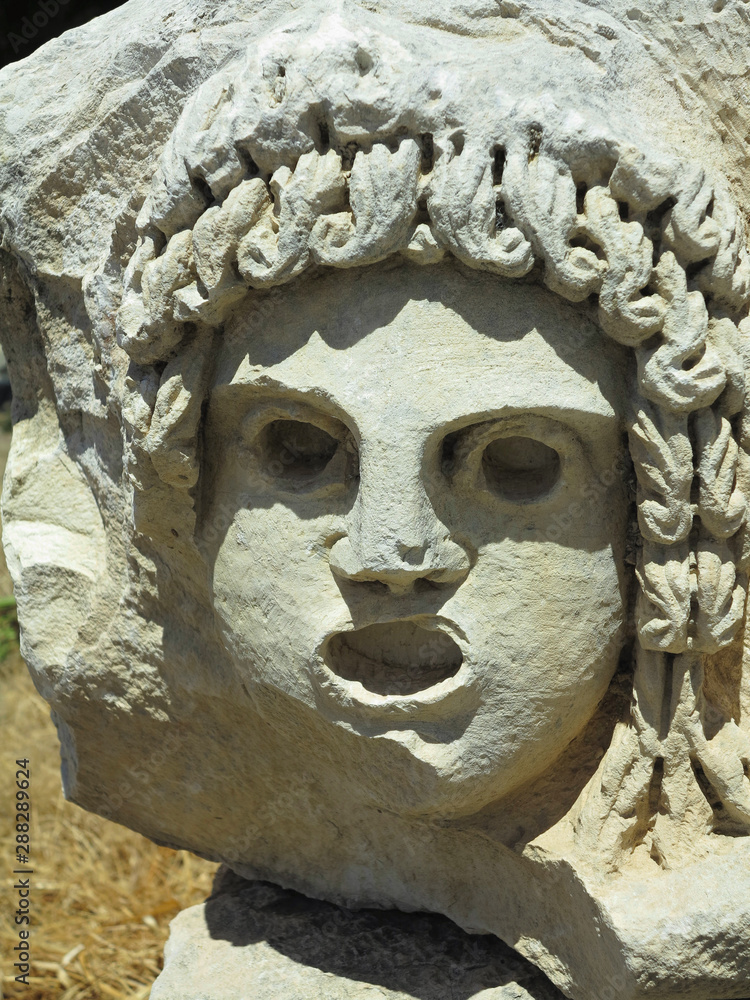 Fototapeta premium Bas-relief and stone sculpture of ancient Roman theater masks