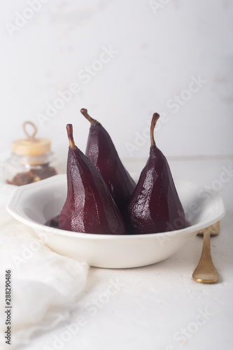 Poached pears in red mulled wine with cinnamon and anise