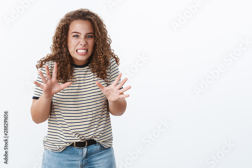 Girl retelling disgusting disturbing story cringing grimacing face reluctant aversion raise hands chest gesturing clench teeth displeased look intense dislike, standing white background emotive