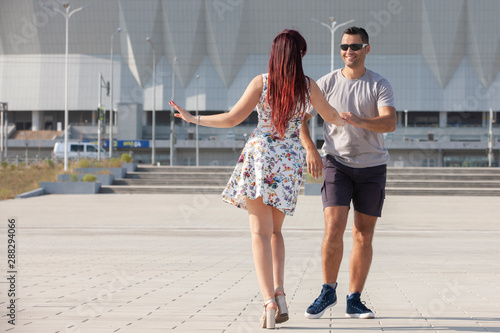 Young couple dances Caribbean Salsa. Social activity concept.