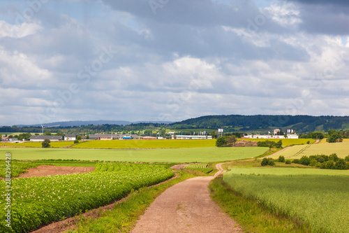 Gravel road towards Falkoping a Swedish town in the countryside