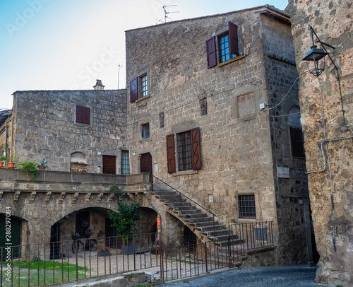 old stone houses in narrow streets in the old town of Viterbo, Italy