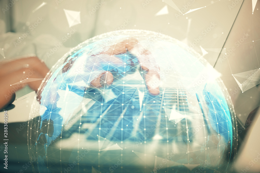 Multi exposure of businessman working on laptop on background. International business hologram in front. Concept of success. Multi exposure of businessman working on laptop on background. International business hologram in front. Concept of success.