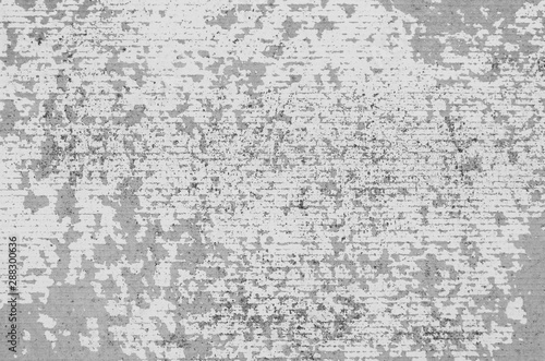 Abstract gray background of scratched slate surface closeup.