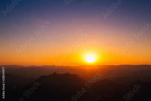 Dramatic sunset mountains landscape from Monsoon Palace in Udaipur, India
