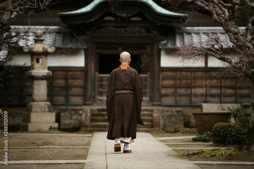 A monk in court yard of a monastery in Kamakura, Japan. © Igor