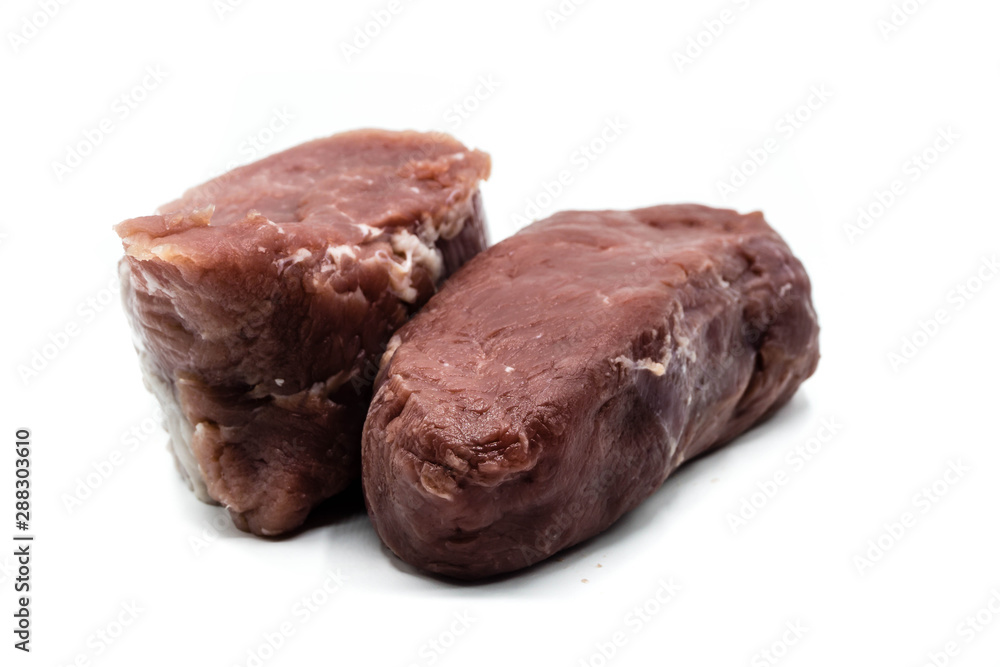 raw pork tenderloin and beef tenderloin isolated on white background