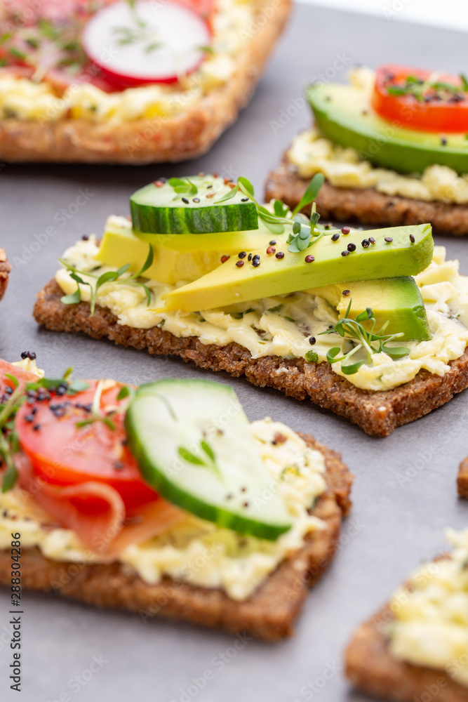 Sandwiches with cream cheese, vegetables and salami. Sandwiches with cream cheese, vegetables and salami.