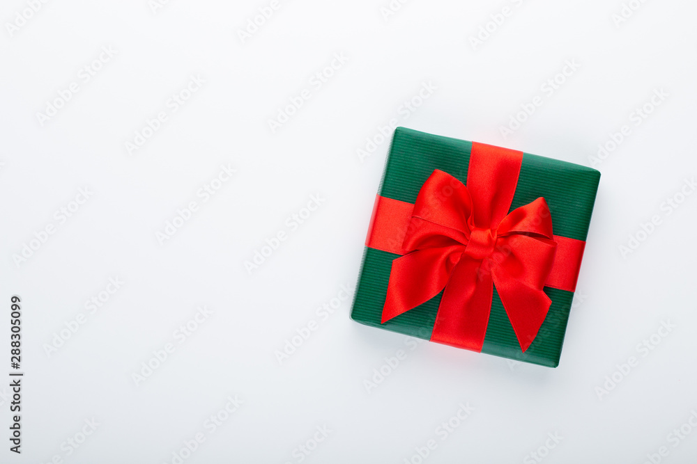 Gift or present box and stars confetti on color table top view. Flat lay composition for birthday, mother day or wedding. Gift or present box and stars confetti on color table top view. Flat lay composition for birthday, mother day or wedding.