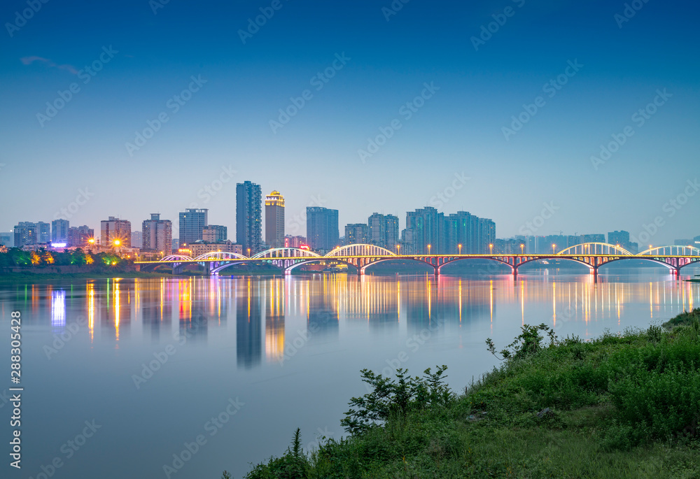 Naklejka premium Min River Bridge and City View, Leshan City, Sichuan Province, China