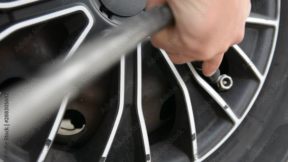hand inflates tires. Close up selective focus. hand inflates tires. Close up selective focus.
