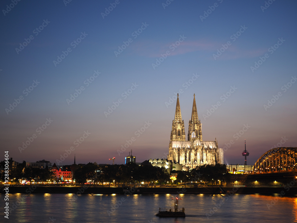 St Peter Cathedral and Hohenzollern Bridge over river Rhine in K