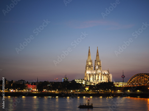 St Peter Cathedral and Hohenzollern Bridge over river Rhine in K © Claudio Divizia