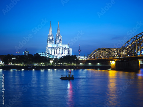 St Peter Cathedral and Hohenzollern Bridge over river Rhine in K photo