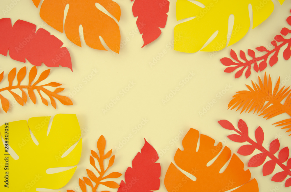 Flat lay red, orange and yellow paper palm leaves frame on white background. Autumn is coming concept mockup with copy space