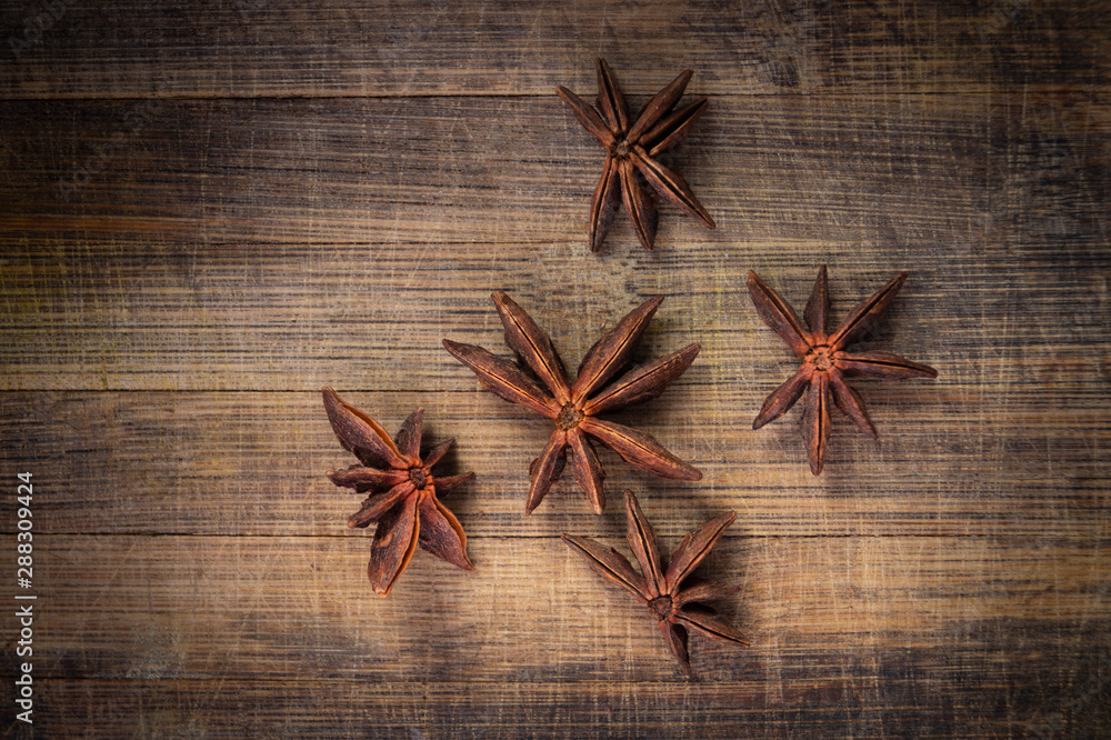 STAR ANISE ON WOODEN BACKGROUND, MACRO PHOTOGRAPHY OF GARAM MASALA ON WOODEN TEXTURE BACKGROUND, STAR ANISE ON WOODEN BACKGROUND, MACRO PHOTOGRAPHY OF GARAM MASALA ON WOODEN TEXTURE BACKGROUND,