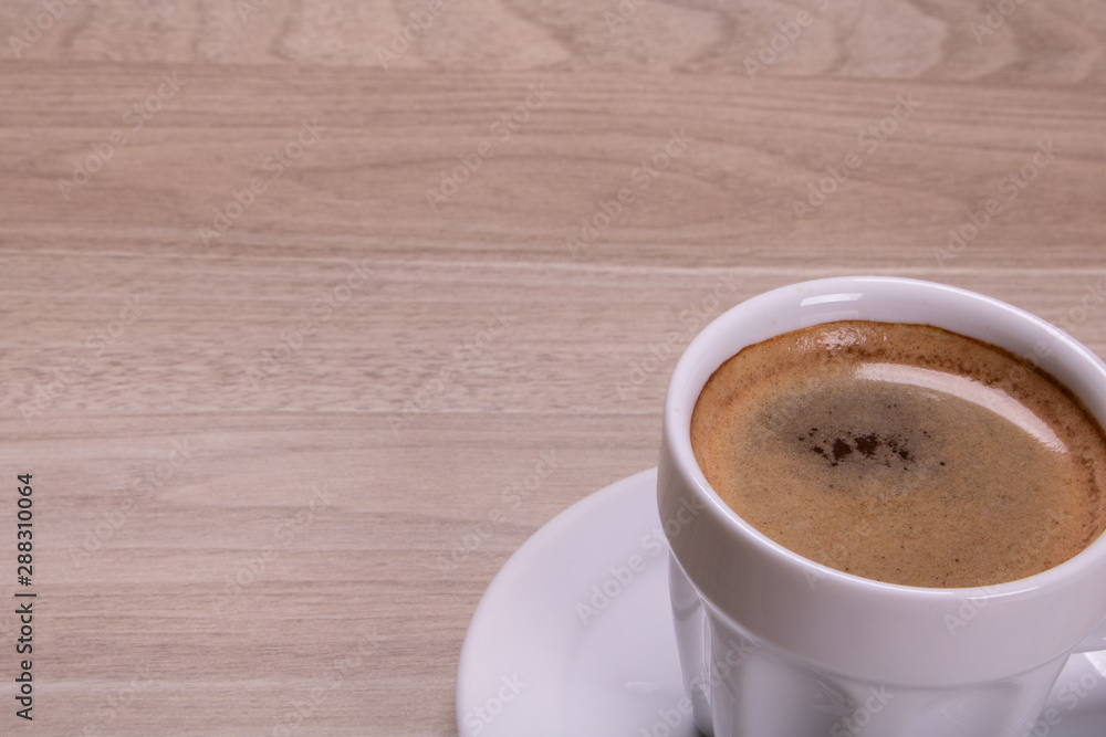 cup of coffee on wooden table cup of coffee on wooden table
