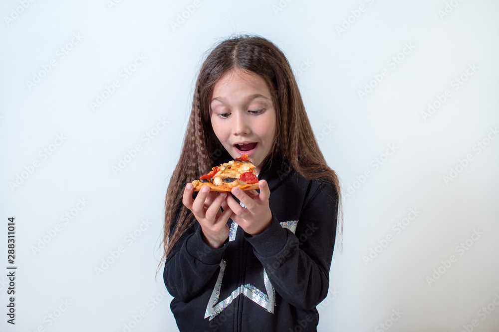 Little brunette girl eating pizza Little brunette girl eating pizza
