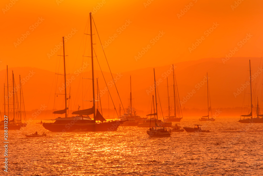 sail boats and yacht at sea sunset. Saint Tropez, France