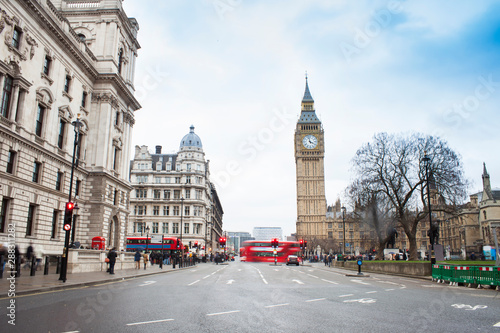 London city scene with red bus and Big Ben in background. Long exposure photo