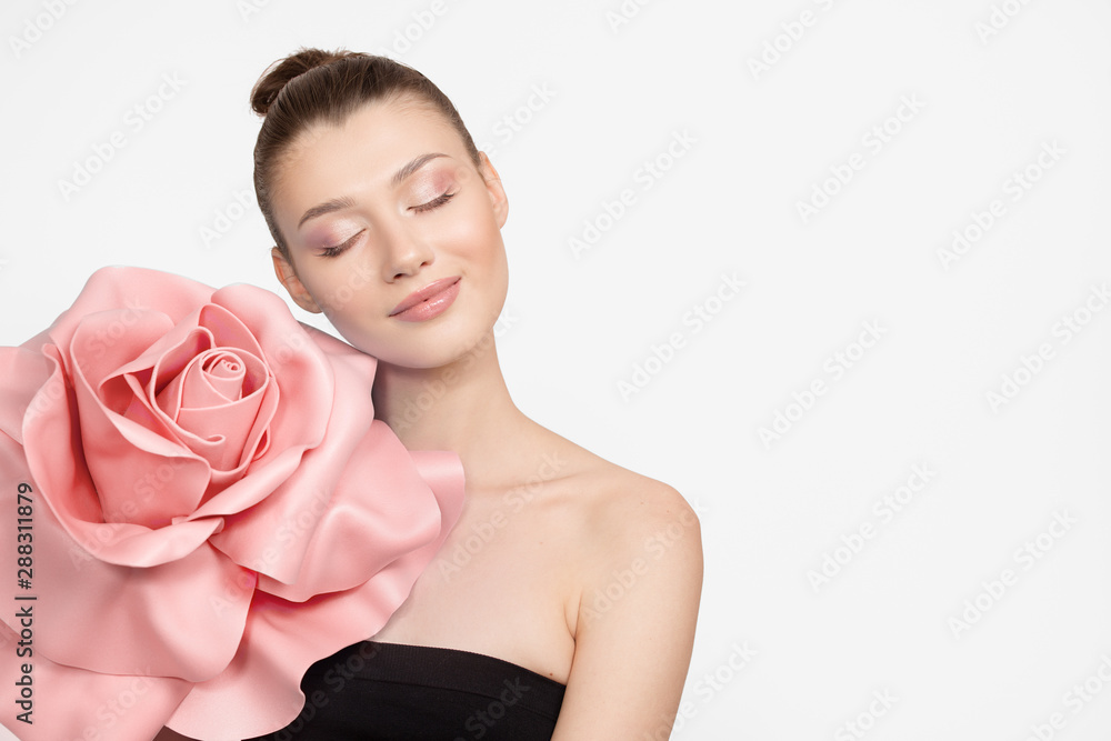 Beautiful woman with natural make-up of roses. tender photo. Gray background Beautiful woman with natural make-up of roses. tender photo. Gray background