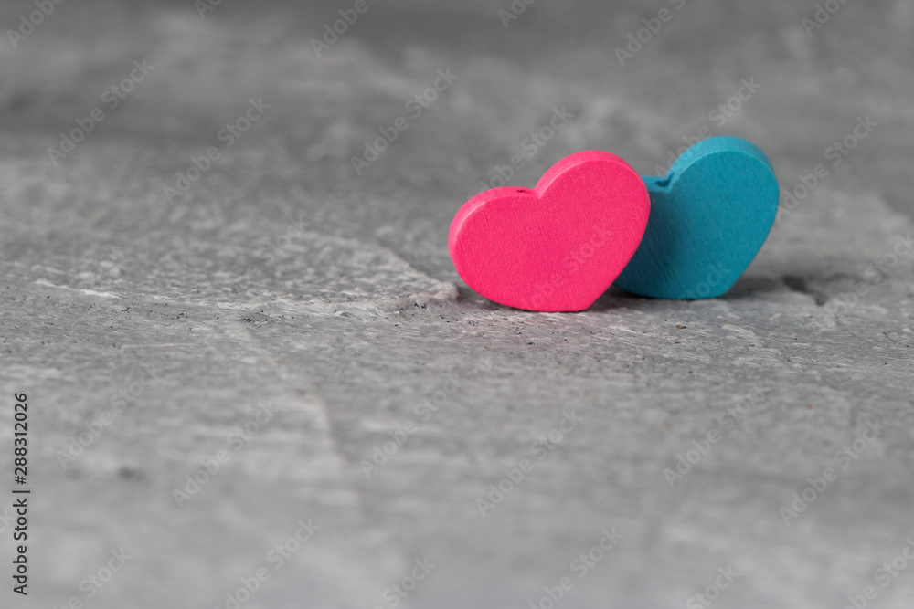 Fototapeta premium two hearts on concrete background. . Valentines day and love concept