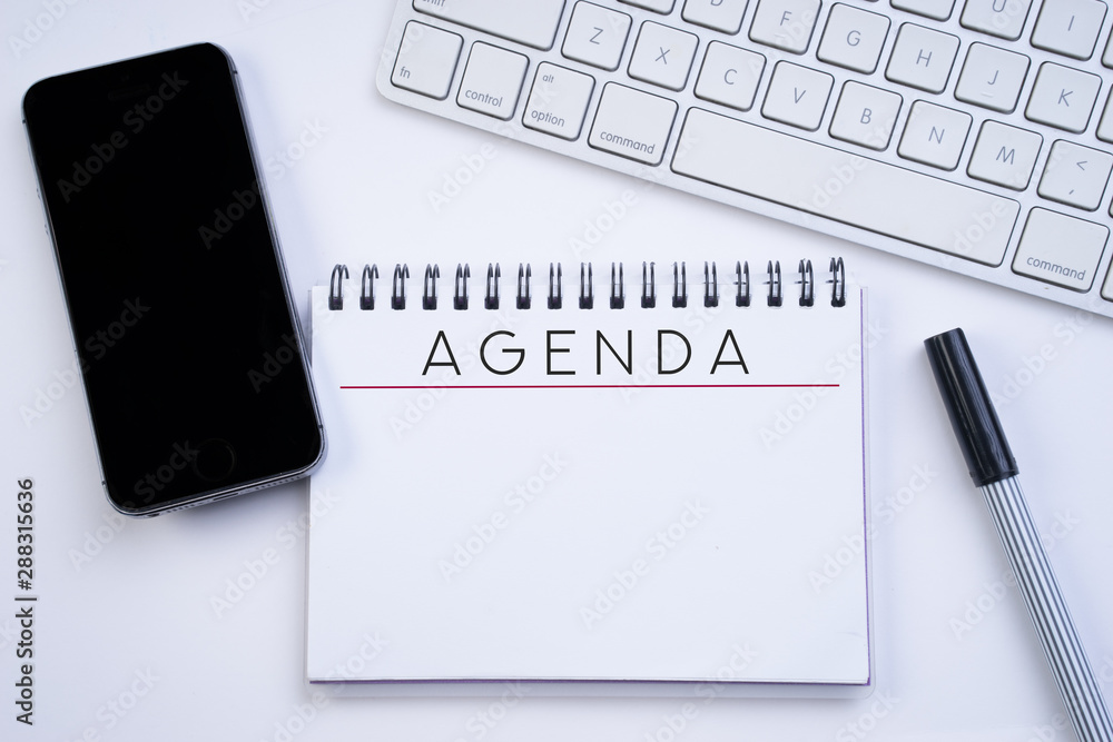 Business agenda, planning concept. Spiral notebook with Agenda text on white background. lay or top view. Stock Photo | Adobe