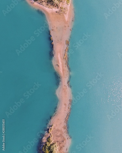 Fototapeta Naklejka Na Ścianę i Meble -  Drone shot over gravel lake