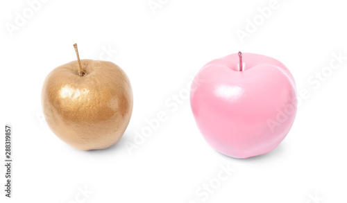 Shiny stylish gold and pink apples on white background