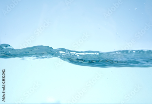 Fototapeta Naklejka Na Ścianę i Meble -  Clear fresh water wave on blue background