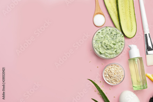 Flat lay composition with handmade face mask and ingredients on pink background. Space for text