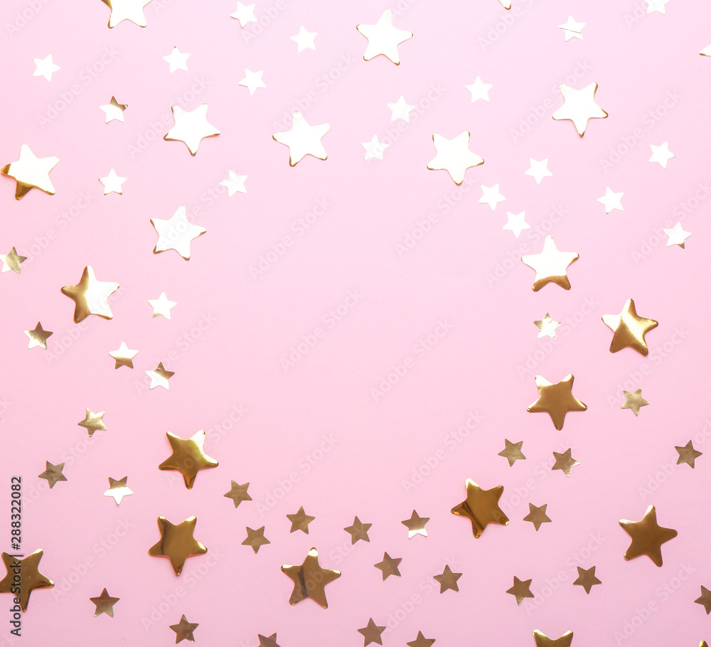 Frame made of confetti stars with space for text on pink background, top view. Christmas celebration Frame made of confetti stars with space for text on pink background, top view. Christmas celebration
